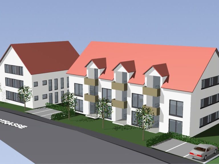 Moderne Wohngebäude mit roten Dächern und Grünflächen zwischen den Häusern.