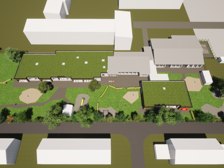 Luftaufnahme eines Kindergartens mit Gebäuden, Spielplätzen und Grünflächen.